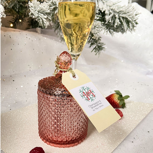 Champagne and strawberries candle in rose gold jar